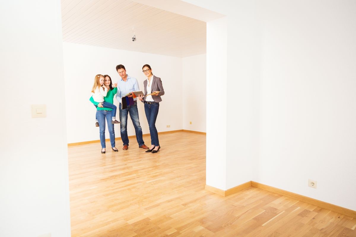 Family Discussing With Their Interior Designer