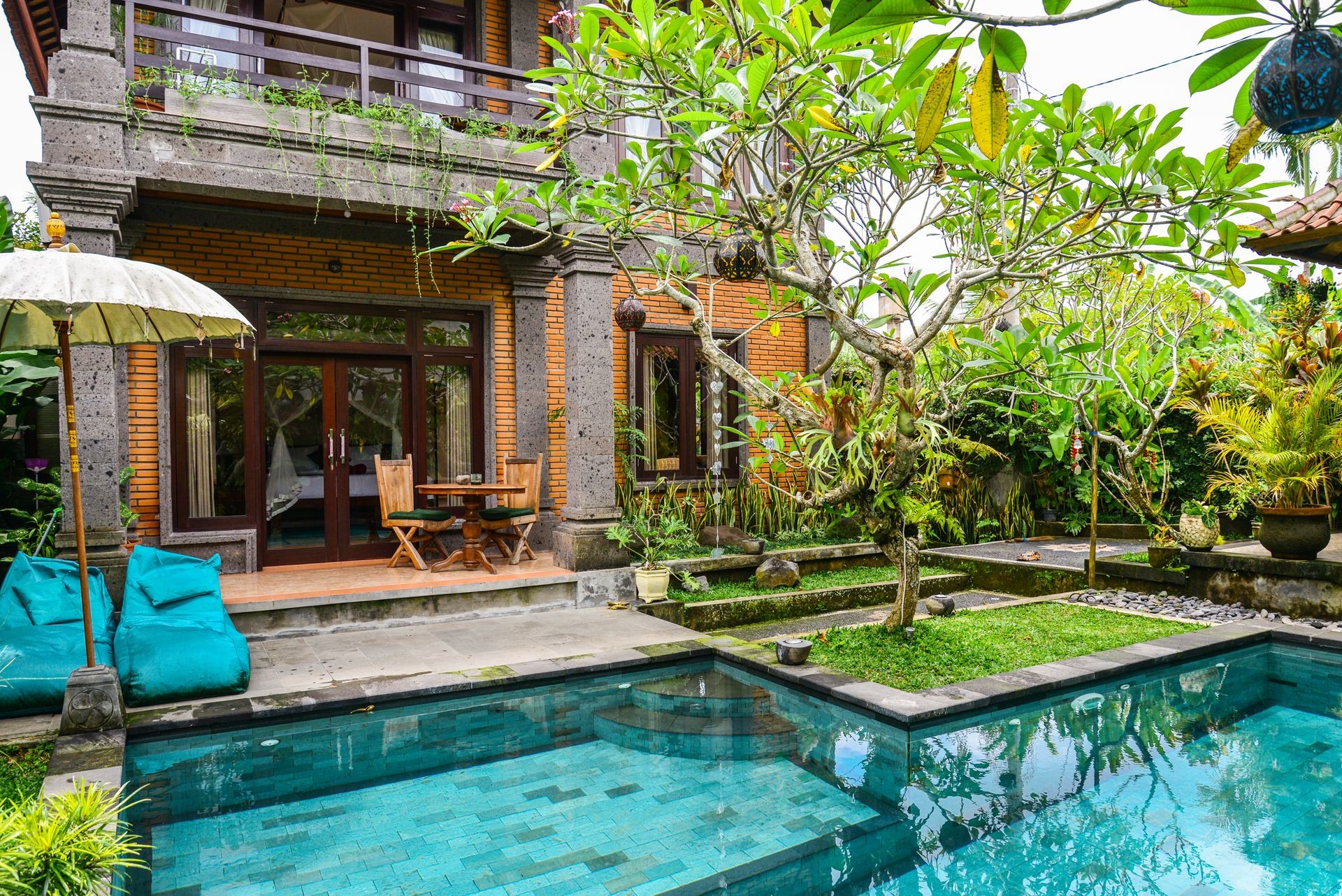 Garden on back yard with swimming pool and cozy gazebo near traditional balinese house for rent, Ubud, Indonesia
